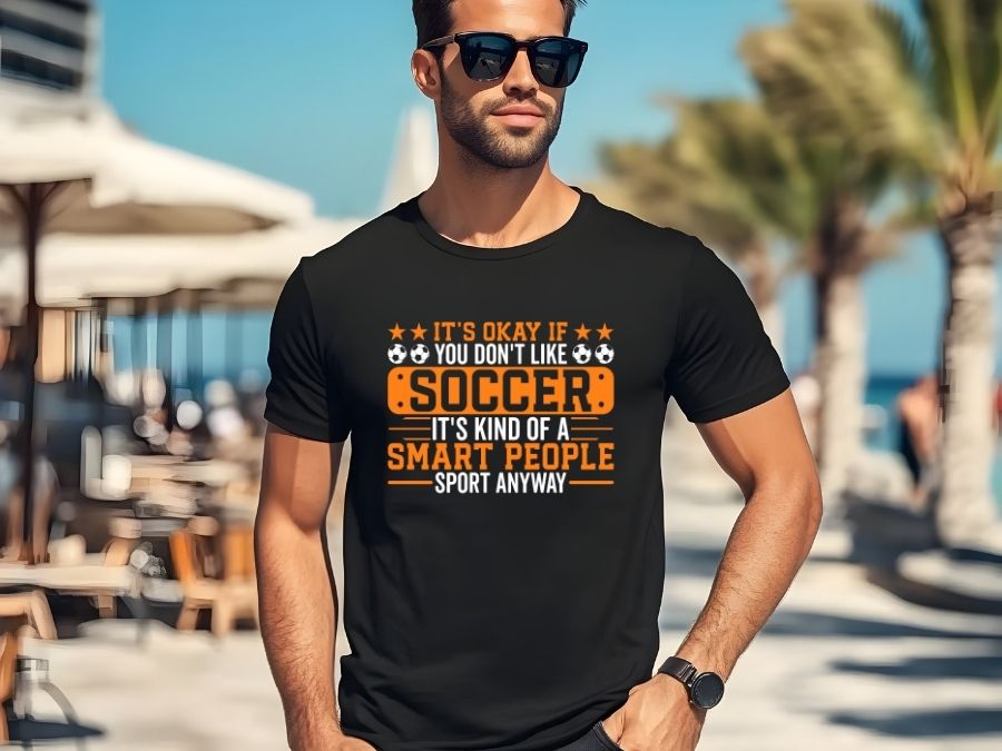 Funny Sports T-Shirts category image showing a man wearing a black tee that reads 'It's Okay If You Don't Like Soccer It's Kind of a Smart People Sport Anyway'.