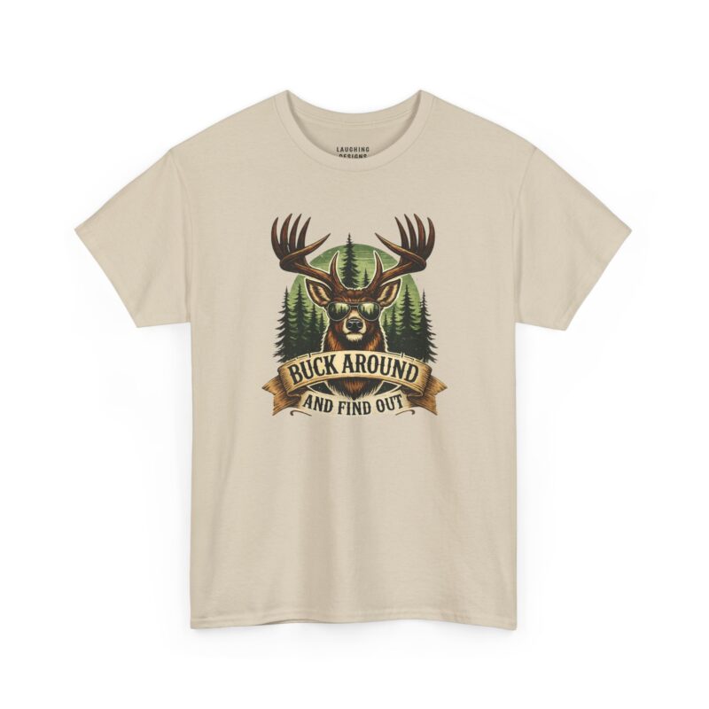Buck Around And Find Out T-Shirt - Illustration of a buck wearing sunglasses with a vintage banner reading "BUCK AROUND AND FIND OUT" Pine tree background on a Sand Color tee.