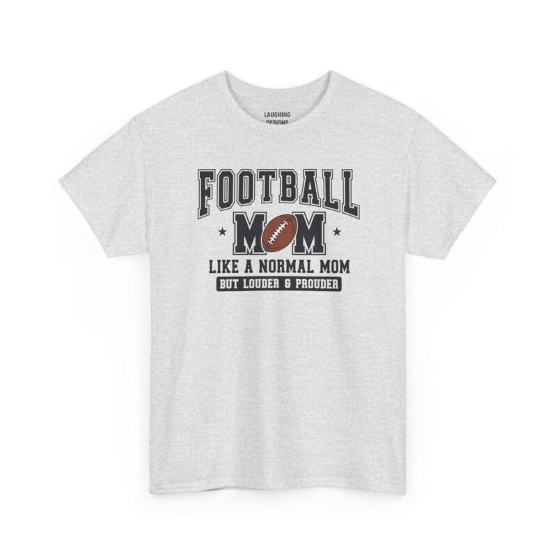 Football mom t-shirt design with bold varsity-style text reading “Football Mom Like a Normal Mom But Louder & Prouder,” featuring stars and a brown football graphic, printed cleanly on a classic Ash Grey cotton shirt.