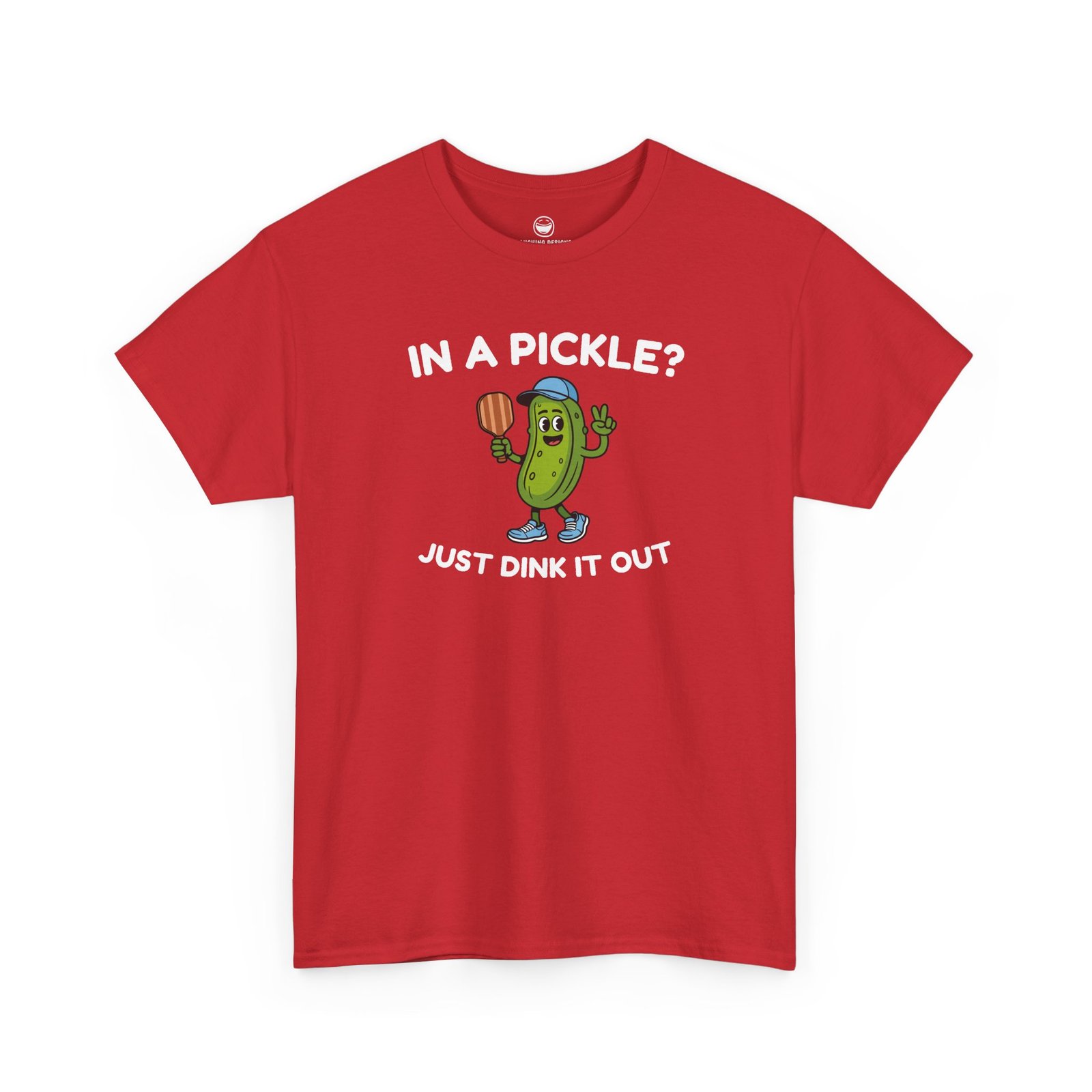 Funny Pickleball T-Shirt with a cartoon pickle character wearing a cap and holding a paddle between text reading "IN A PICKLE? JUST DINK IT OUT", printed on a Red color cotton shirt.