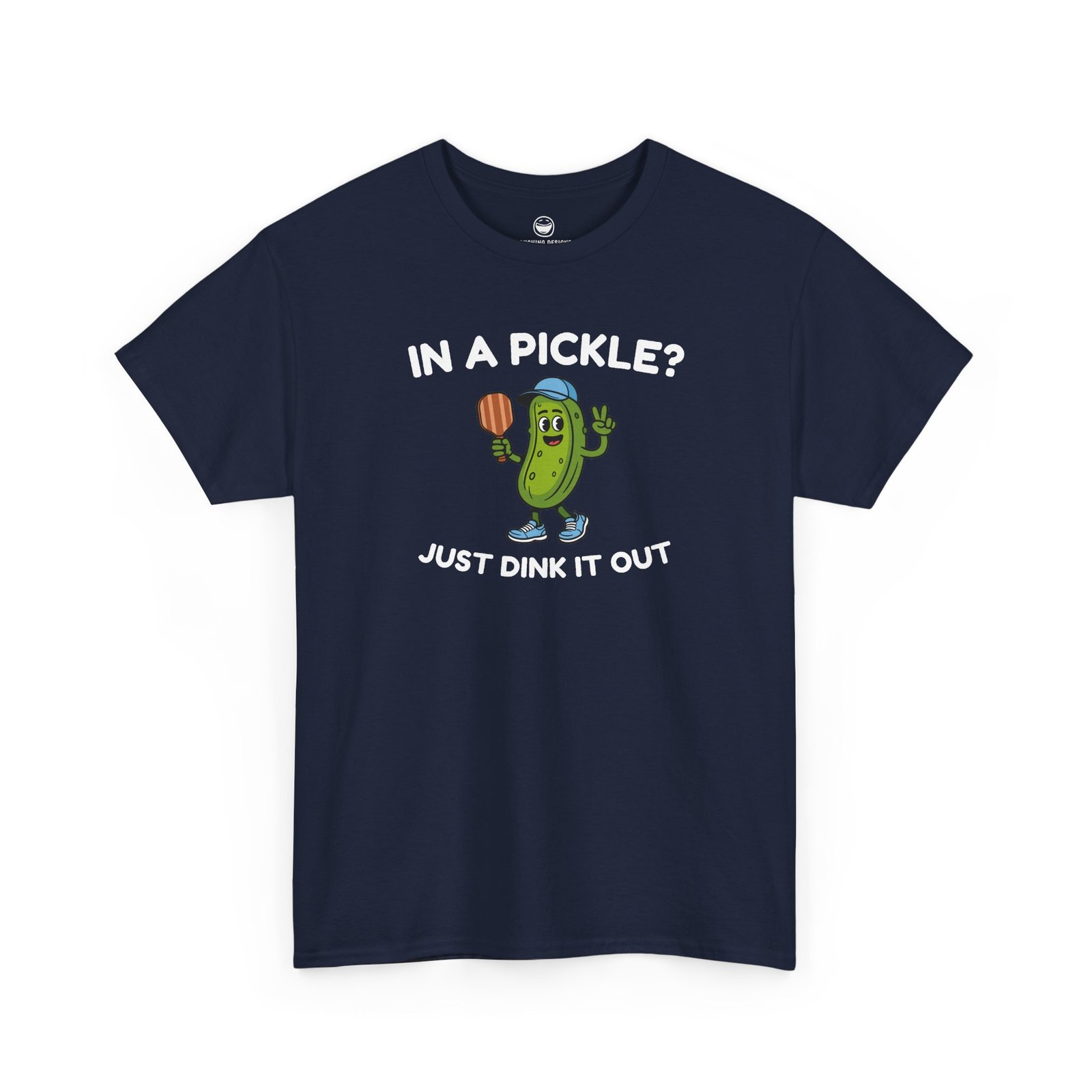 Funny Pickleball T-Shirt with a cartoon pickle character wearing a cap and holding a paddle between text reading "IN A PICKLE? JUST DINK IT OUT", printed on a Navy Blue color cotton shirt.