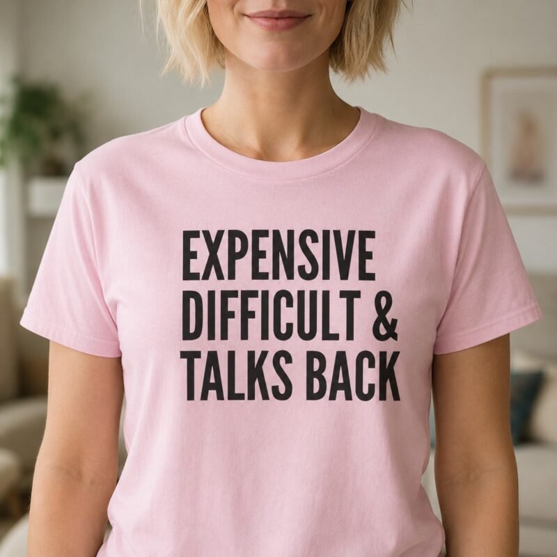 Expensive Difficult & Talks Back T-Shirt by Laughing Designs, female model wearing a light pink shirt with bold black typography reading Expensive Difficult & Talks Back.