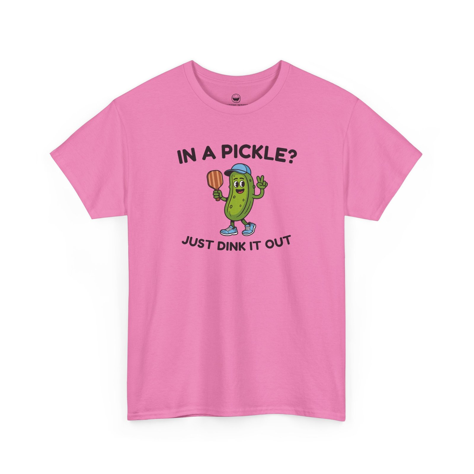 Funny Pickleball T-Shirt with a cartoon pickle character wearing a cap and holding a paddle between text reading "IN A PICKLE? JUST DINK IT OUT", printed on a Azalea Pink color cotton shirt.